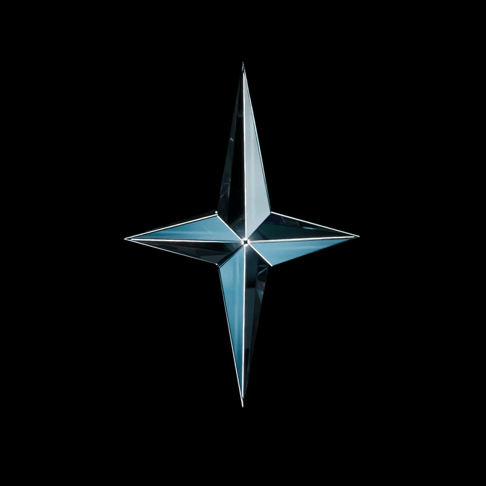 A faceted crystal north star, the Arctic Star Studio emblem, turning slowly in the dark